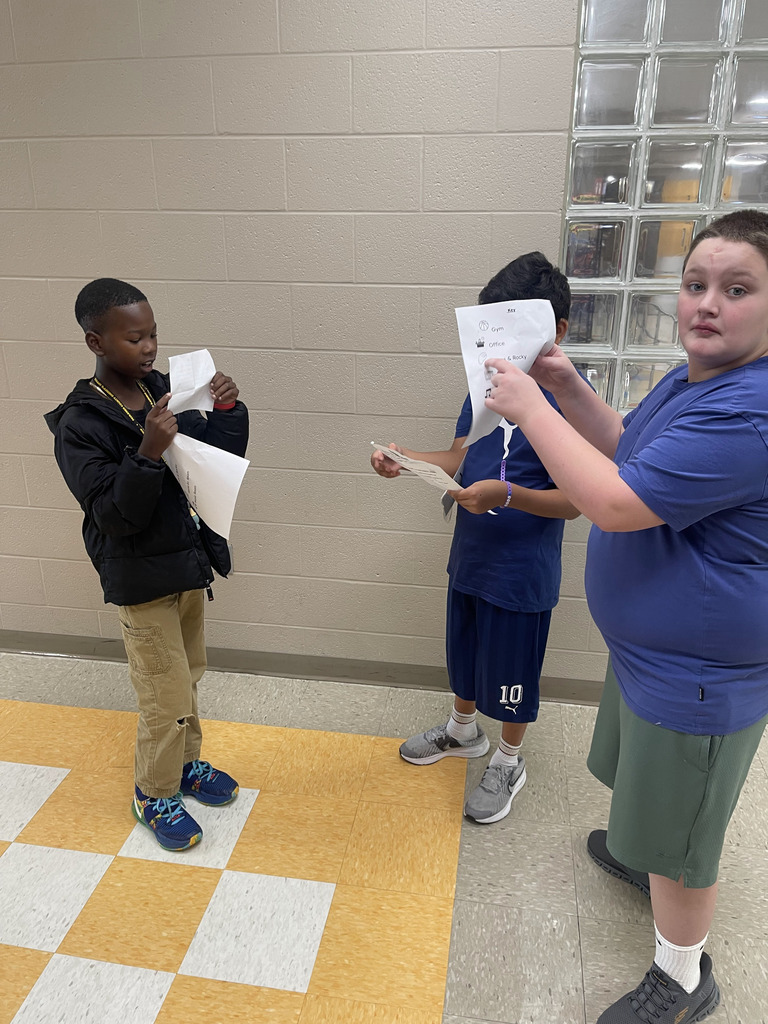 Ms Jackson's class using reading skills and problem solving skills to meet their new class pet.