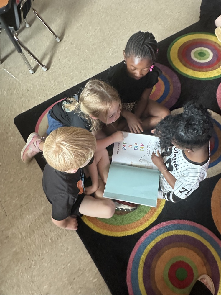 kids reading a book  