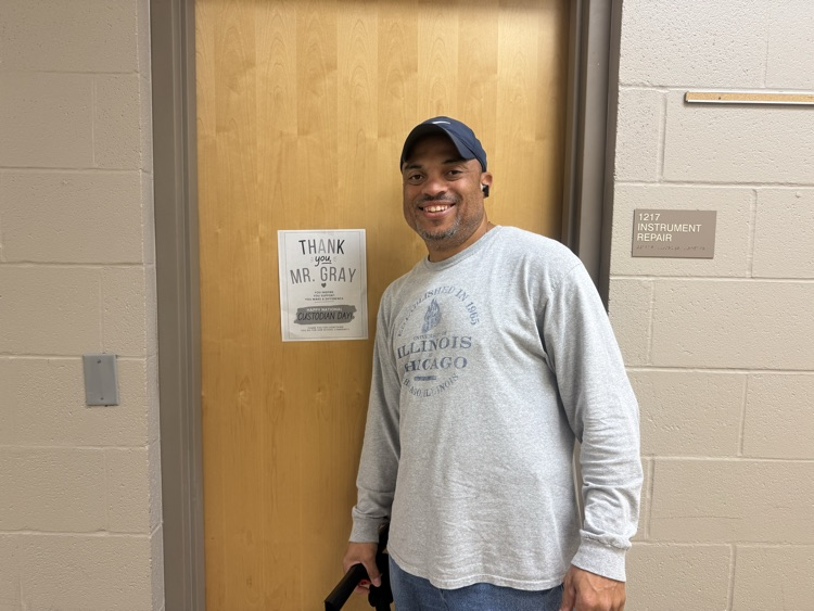 Mr. Gray standing next to a sign that says Thank You!
