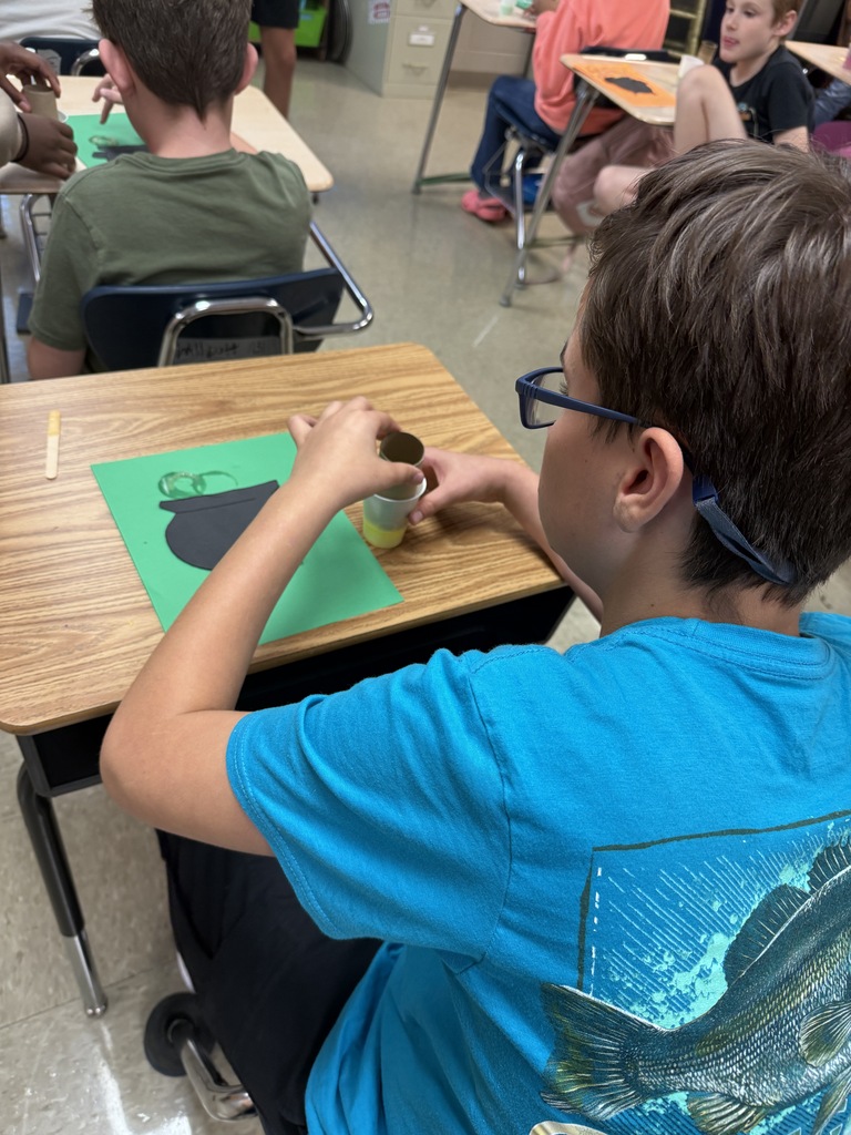 Student working on his bubbly “potion” for his witch’s cauldron potion art