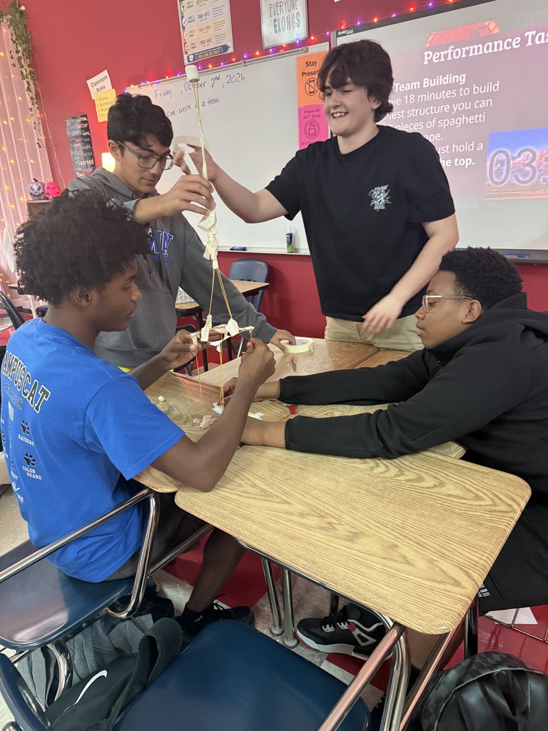 students building their spaghetti structure