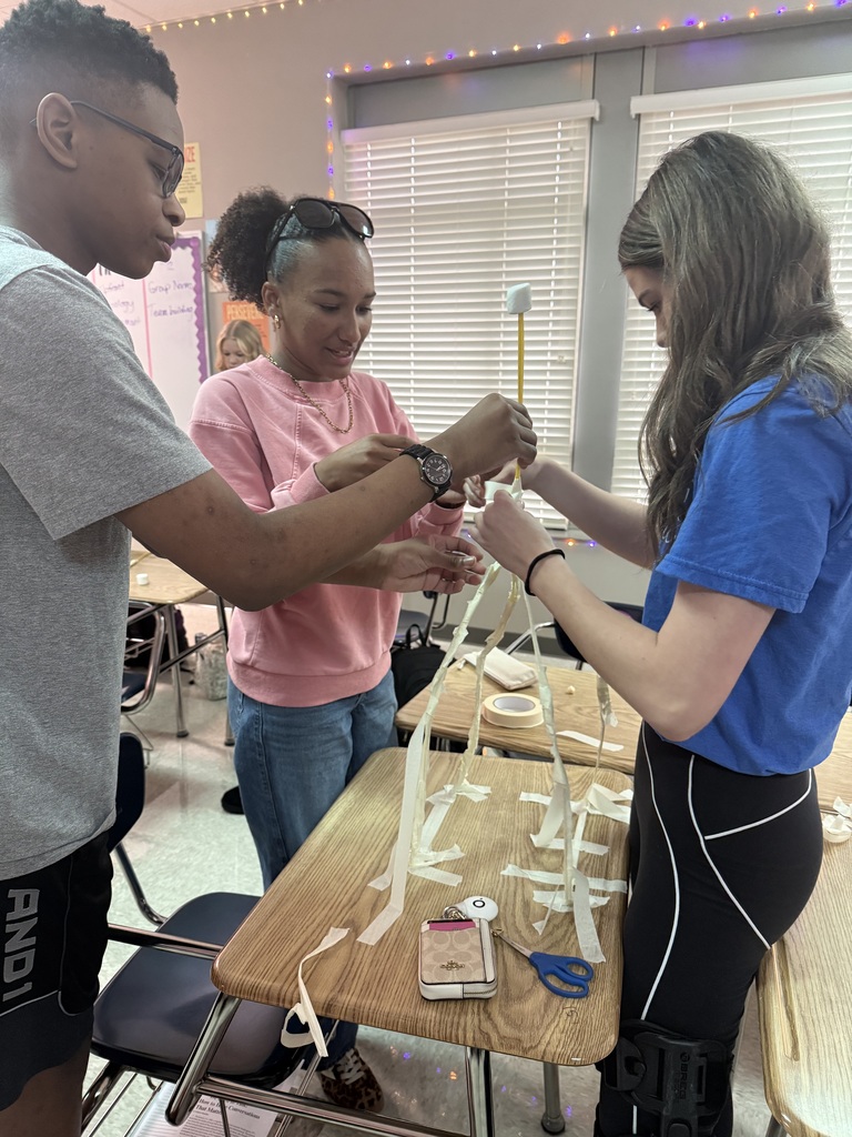students building their spaghetti structure