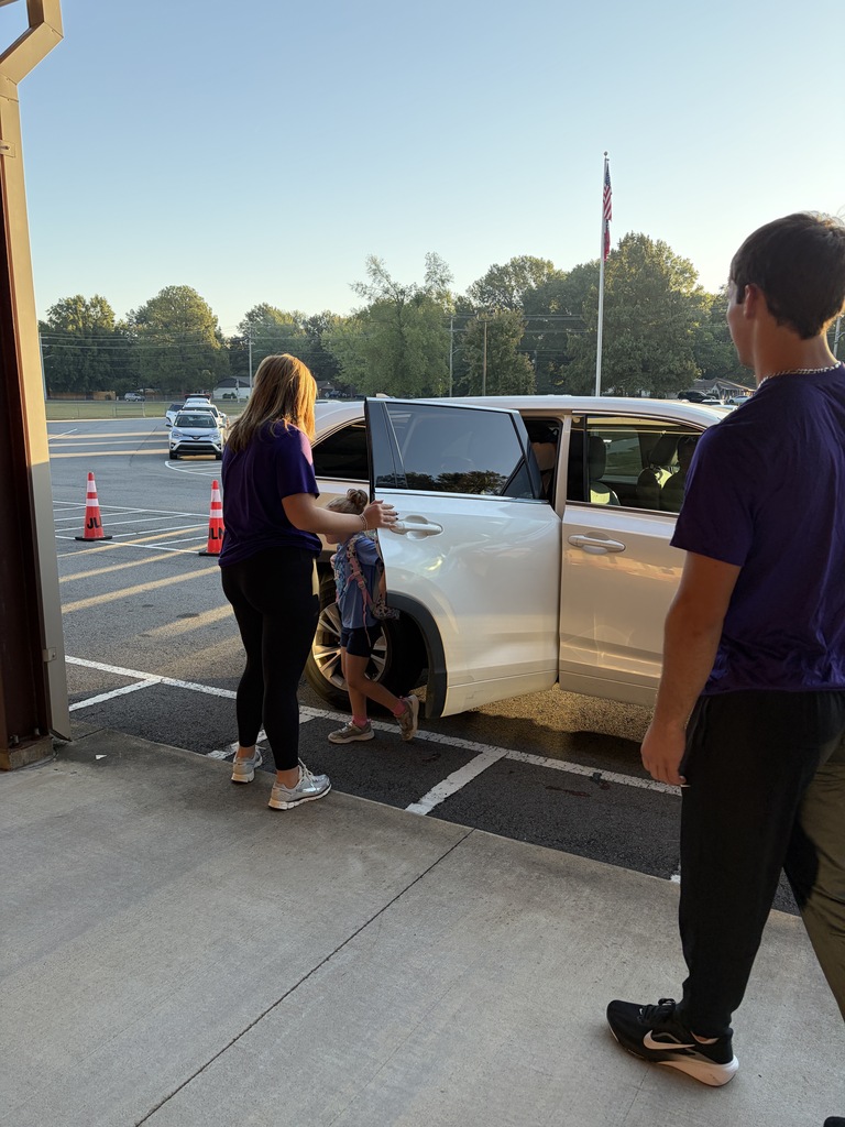 uca track team and Conway volley ball team opening car doors