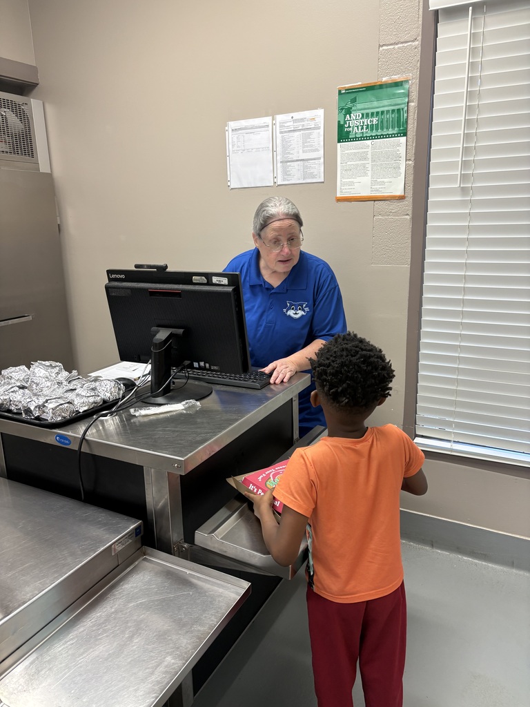 Food Service Worker ringing up student