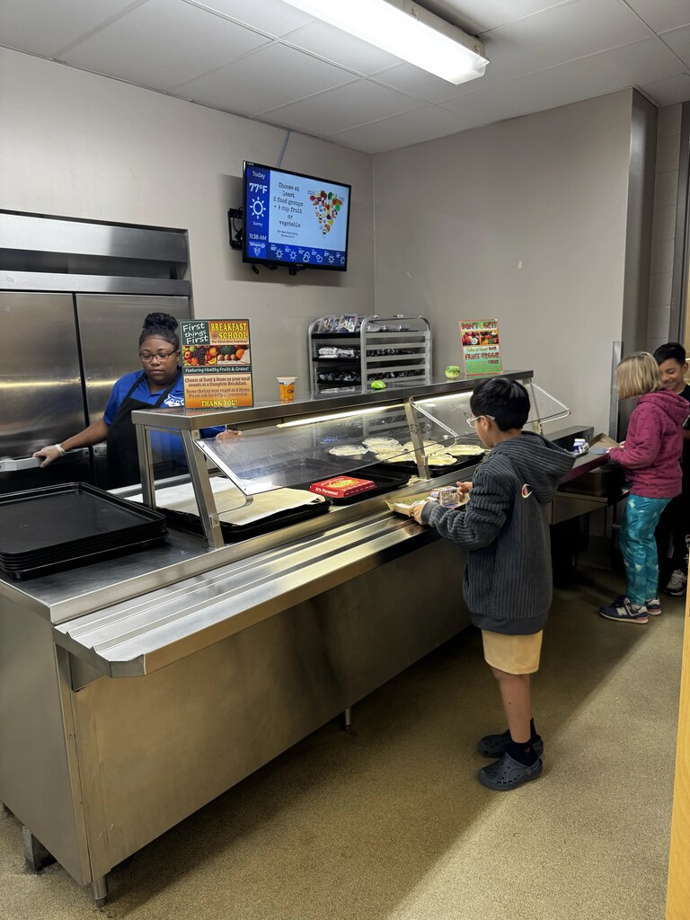 Food Service Worker prepping lunch, serving lunch.