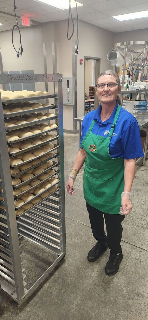 Food Service Worker smiling at camera