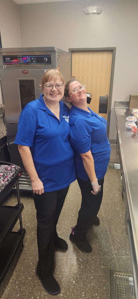 Food service workers smiling at camera