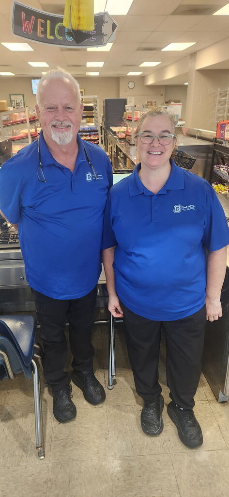Food service workers smiling at camera