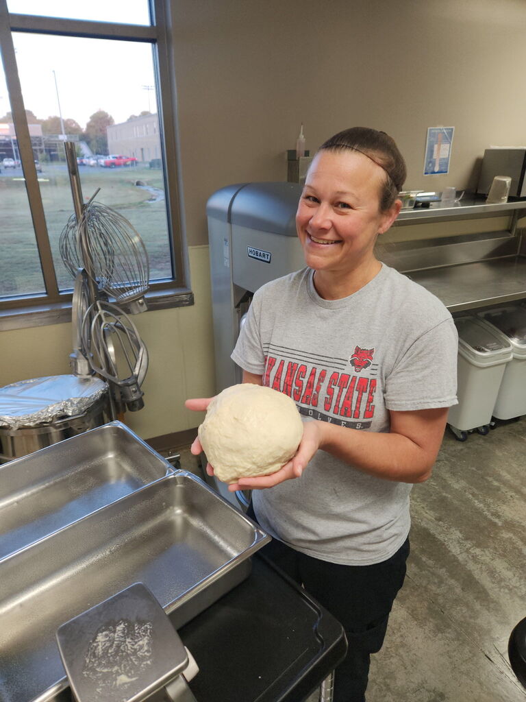 Food service worker smiling at camera