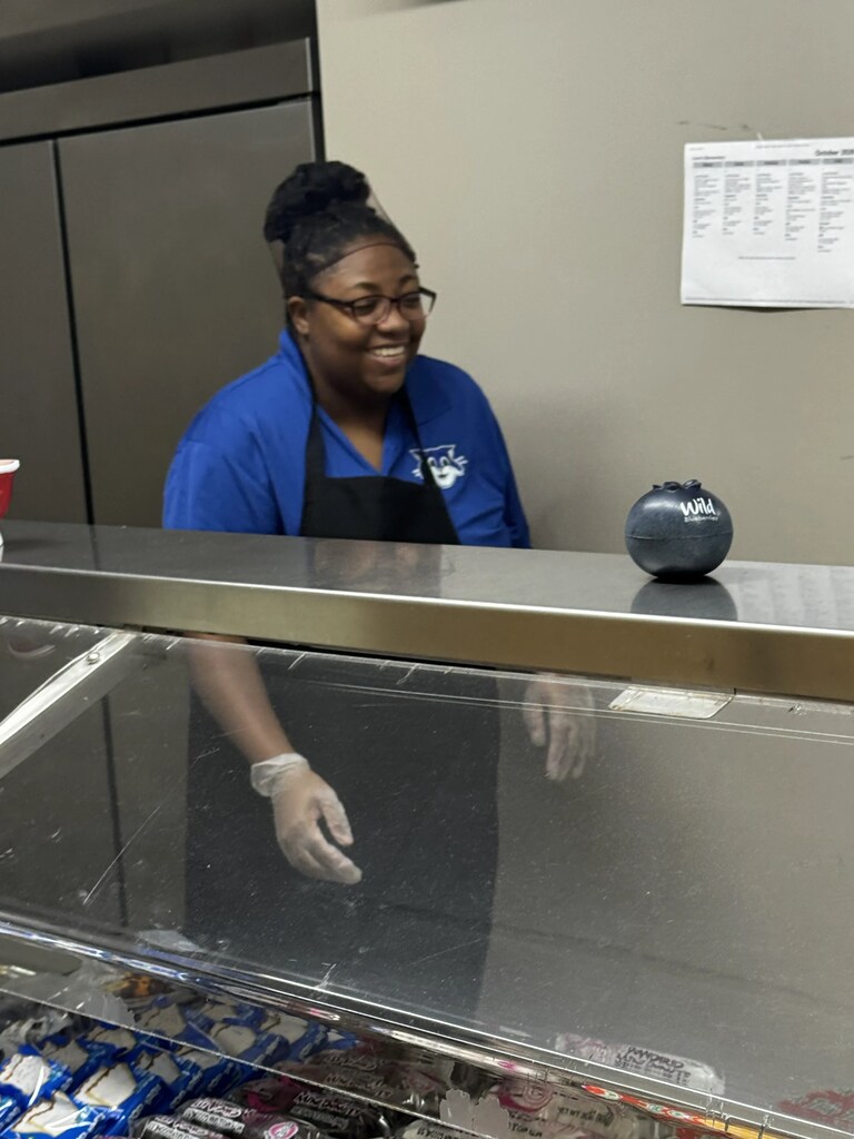 Food service worker smiling at camera
