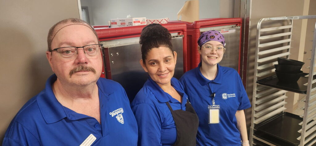 Food service workers smiling at camera