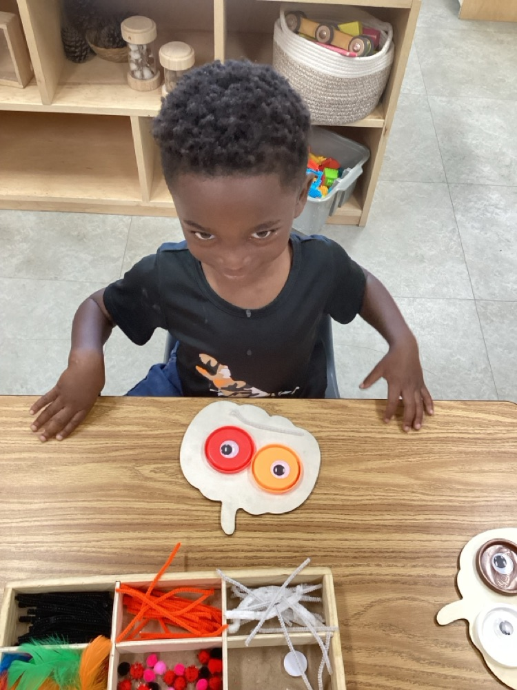 child created emotion face using loose parts 