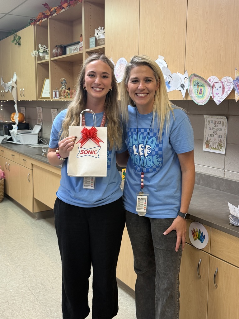 teacher of the month receiving award