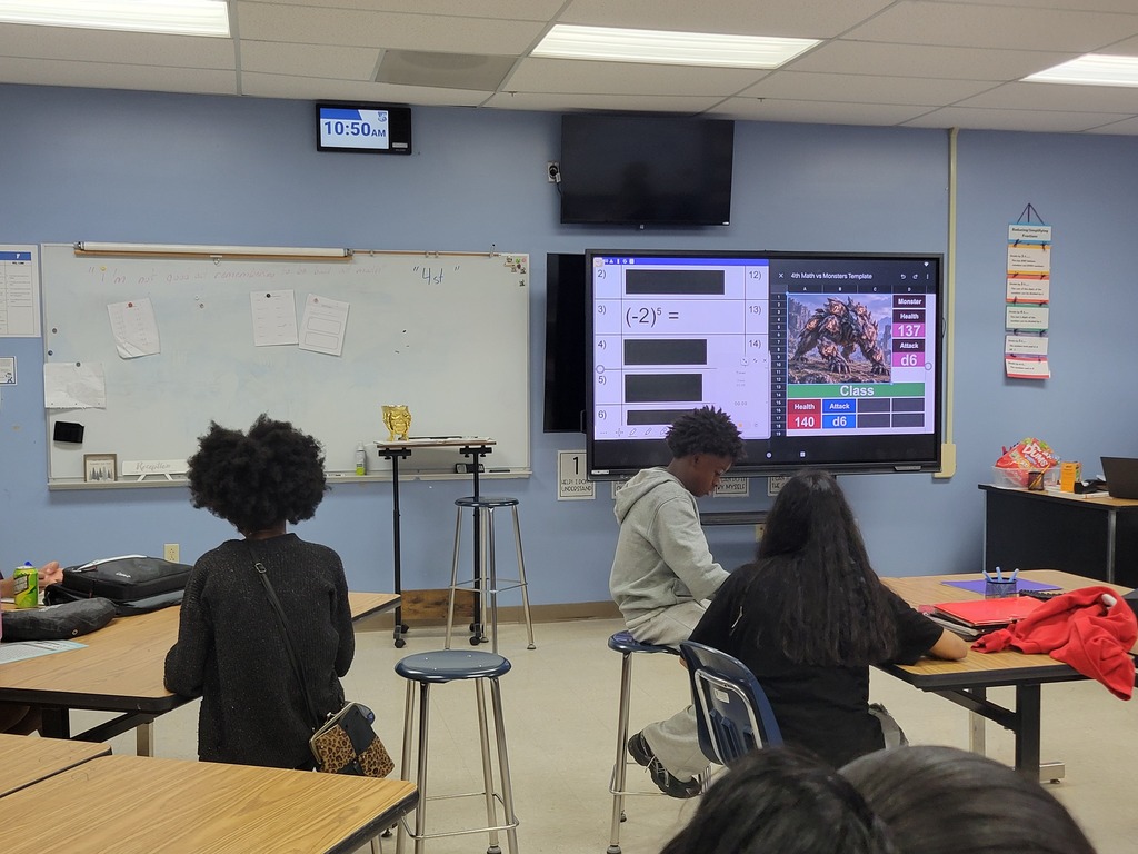 Math students reviewing positive and negative integers with Math vs. Monsters