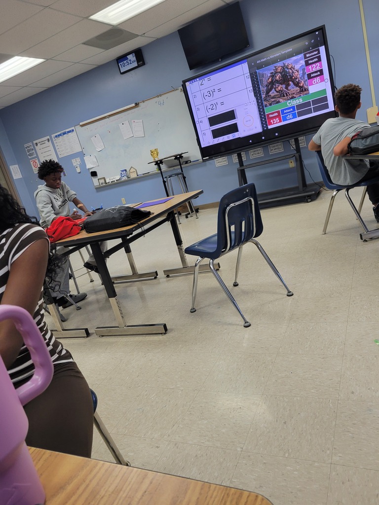 Math students reviewing positive and negative integers with Math vs. Monsters