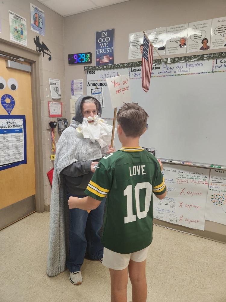Student drawing an UNO card from the teacher “cell membrane” to leave the classroom
