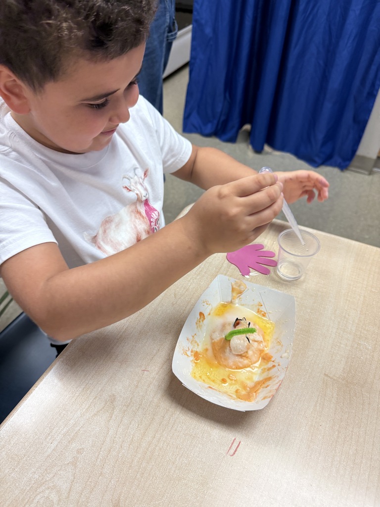 Student mixing ingredients