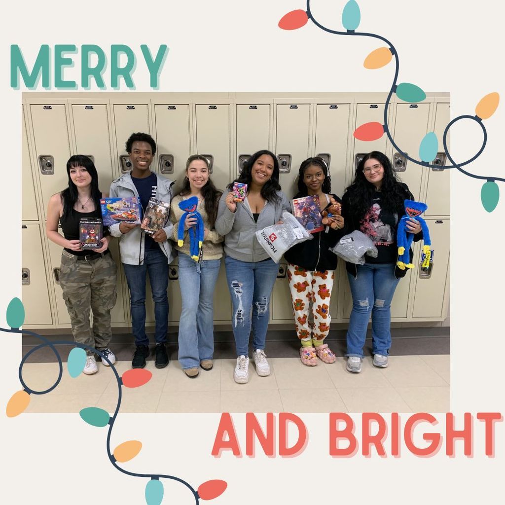 Off white background with an illustrated string of christmas ligts across both the top right and bottom left corners. In the top left corner is the word "merry" in light green and in the bottom right corner are the word "And bright" in a light red. In the center is a picture of students from the Young Feminists Alliance posing with items they purchased to sponsor a family for Christmas.