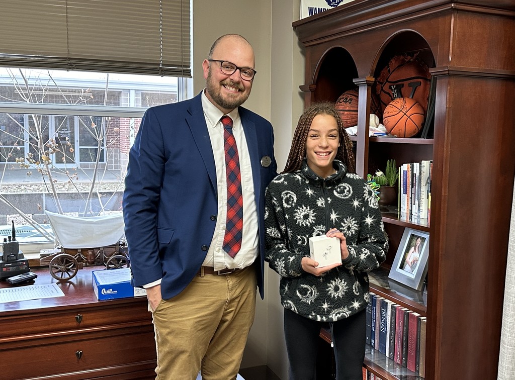 Taylor P. with Mr. Yates getting her AirPod Pros