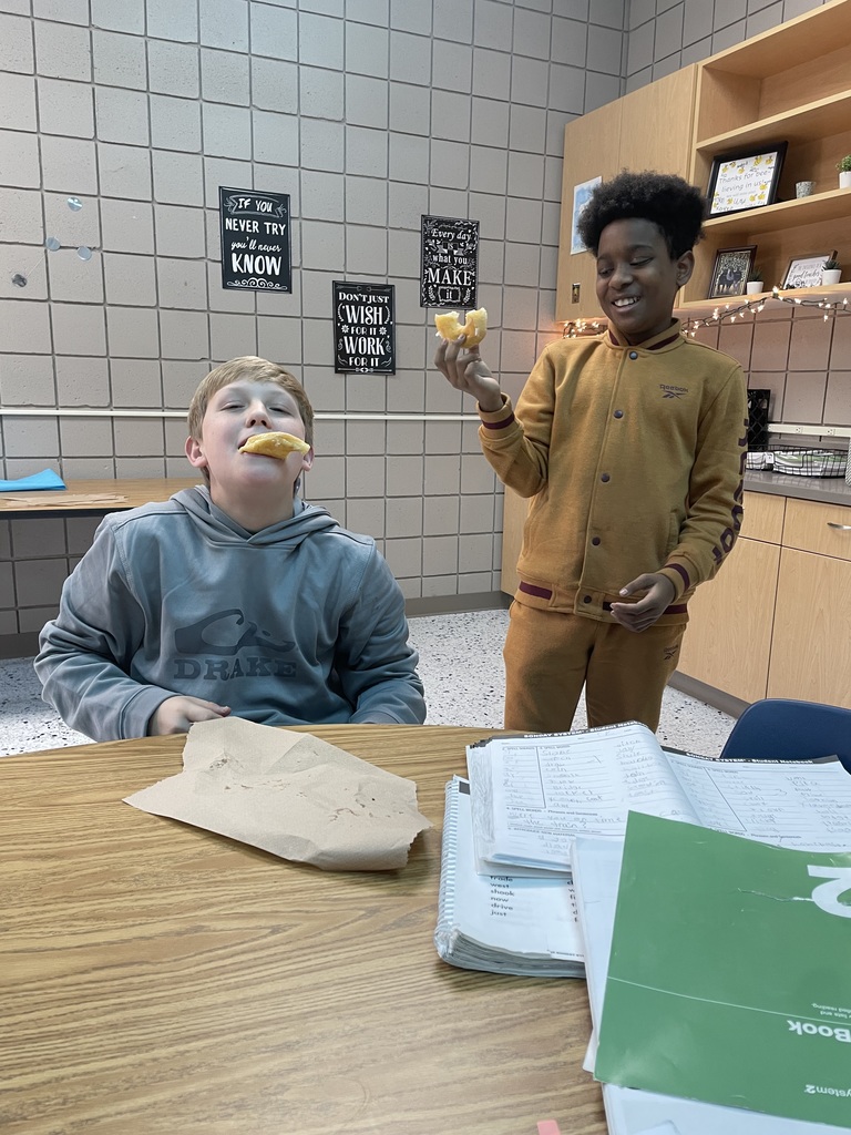 Ms. Frazier's 6th and 7th grade reading classes started working in the fall on writing stories for their own book. They worked on and off until the first week of December. The book finally came in on Wednesday, so I surprised each class with donuts to celebrate the published authors on Thursday!