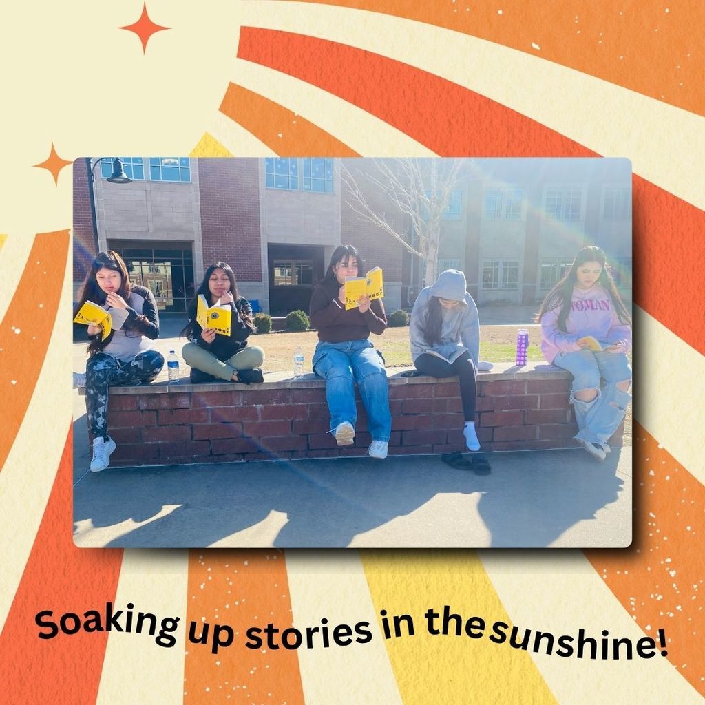 sunshine background.  Image of students sitting on a low wall reading.  "Soaking up stories in the sunshine!" at the bottom.