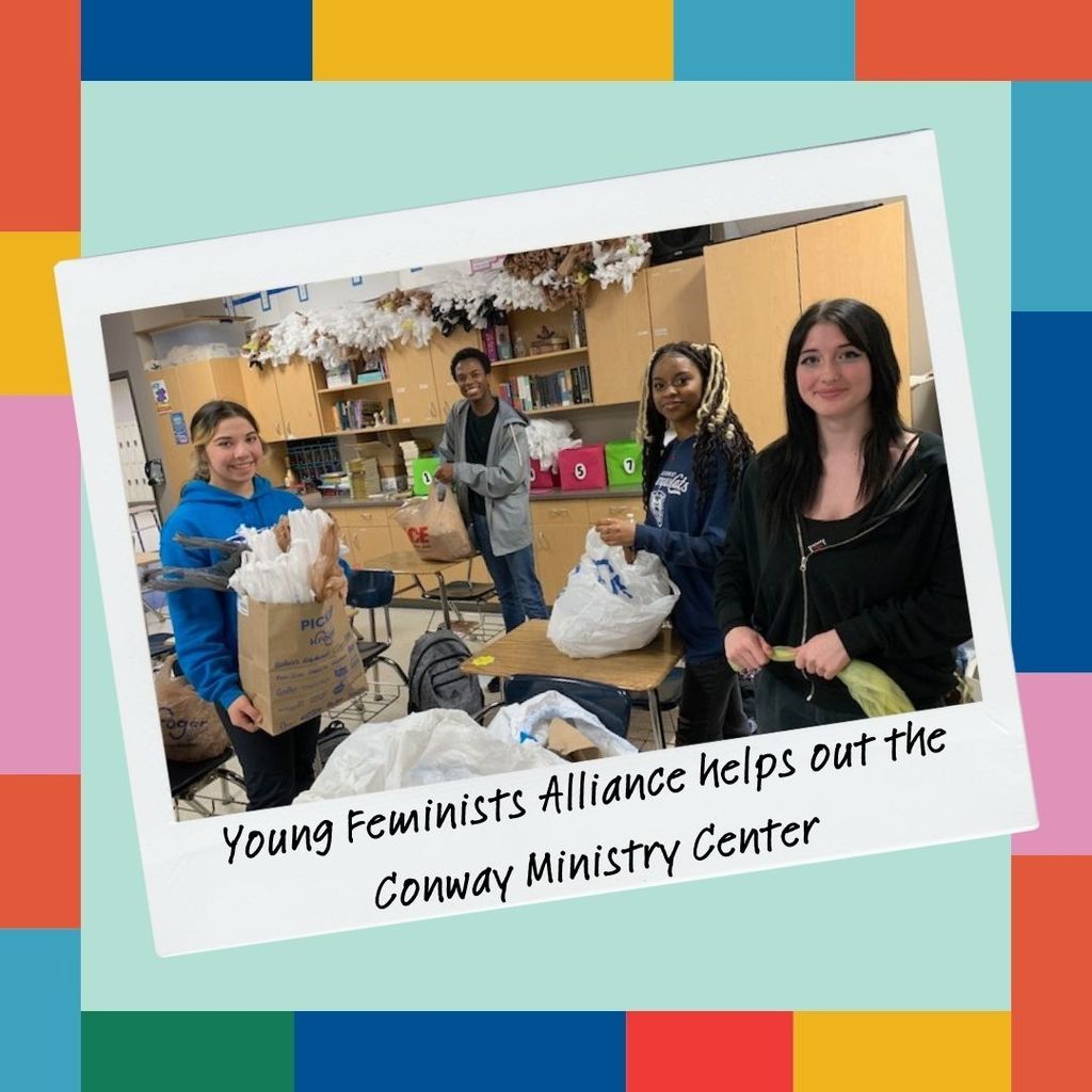 color block border.  pale blue background.  polaroid photo tilted to the side in the center. Image of students preparing shopping bags.  Caption on the photo reads: Young Feminists Alliance helps out the Conway Ministry Center.