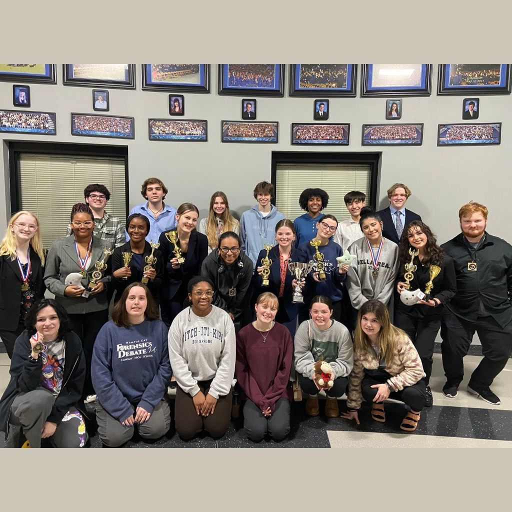 Forensics and Debate students with their awards.