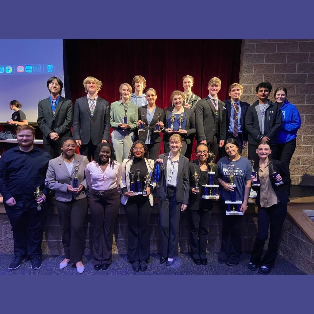 Forensics and Debate students with their awards.