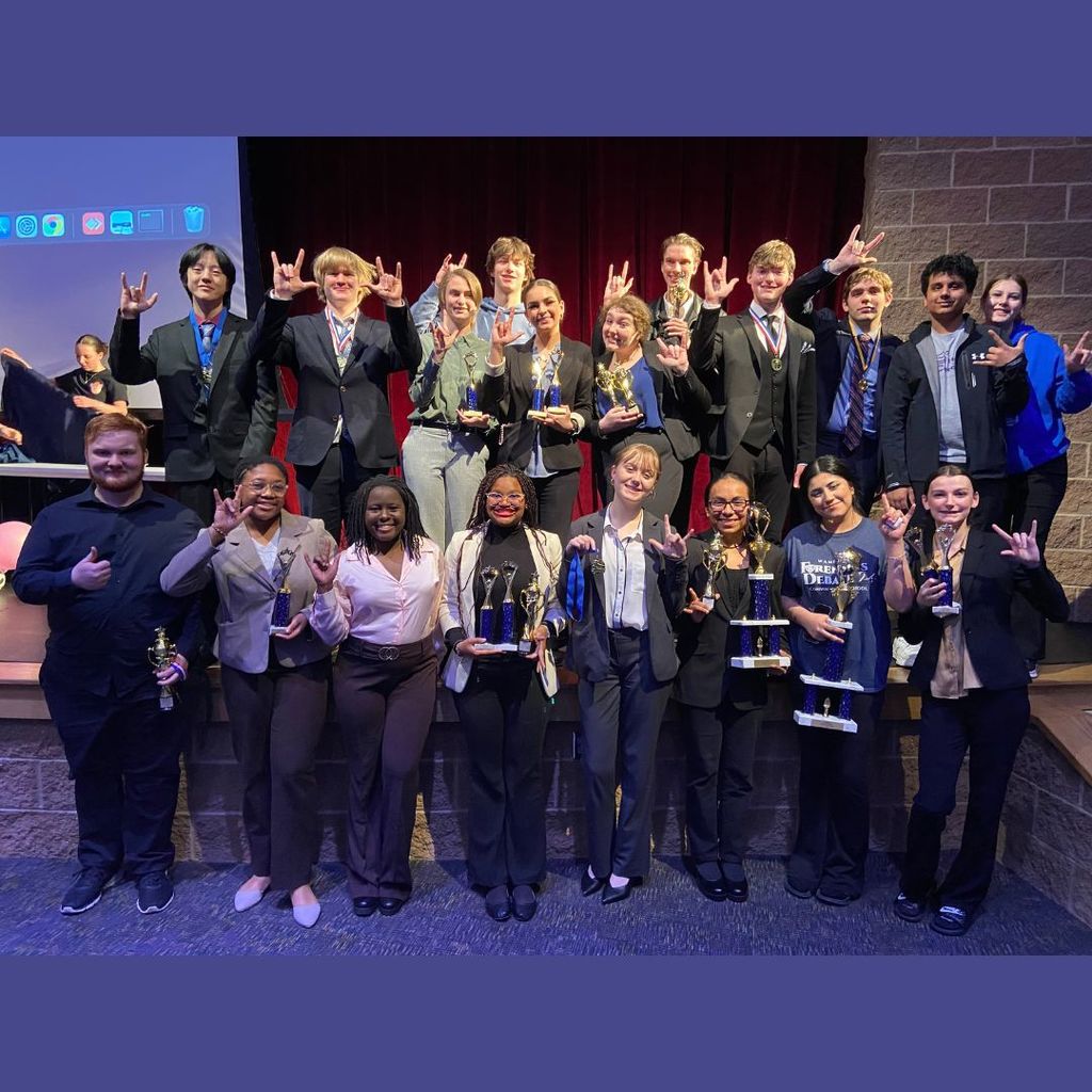 Forensics and Debate students with their awards.