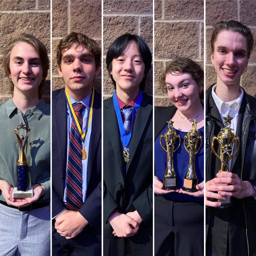 Forensics and Debate students with their awards.