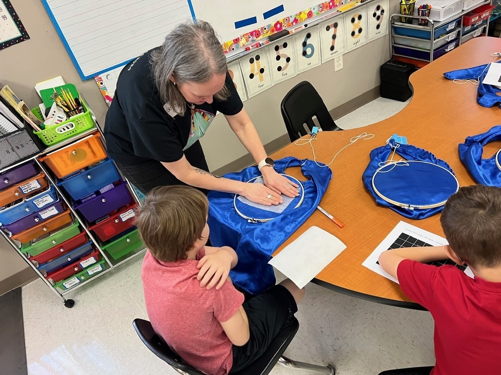Students making birthday capes
