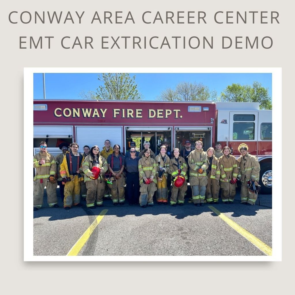 Conway area career center EMT car extrication demo. Image of student with the Conway Fire Department in front of their truck.