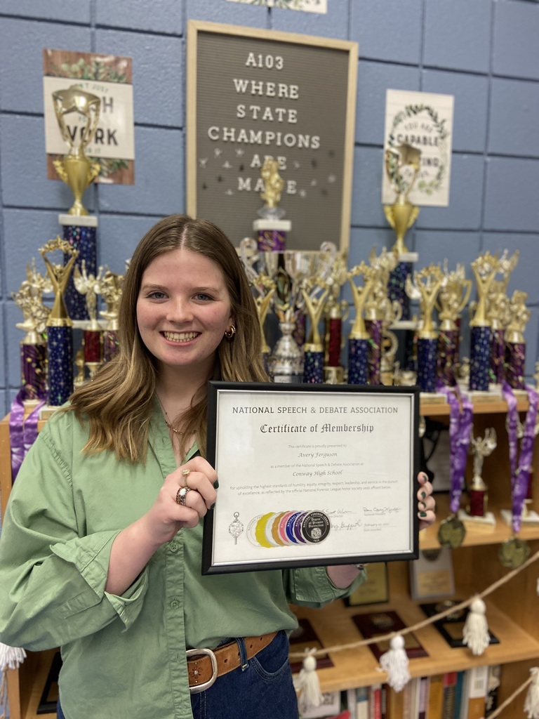 Image of student with certificate.