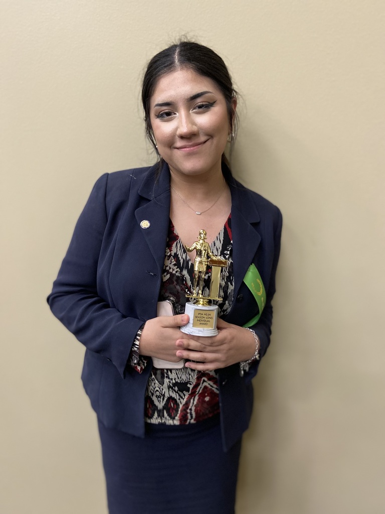 Image of student posing with award.