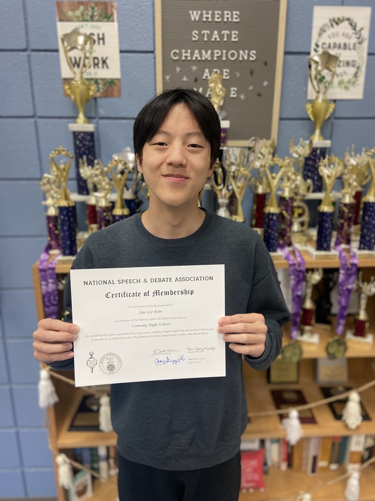Student with certificate.