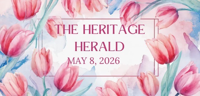 Pink tulips with green leaves frame text that reads "The Heritage Herald, May 8, 2026" on a watercolor background, evoking elegance and freshness.