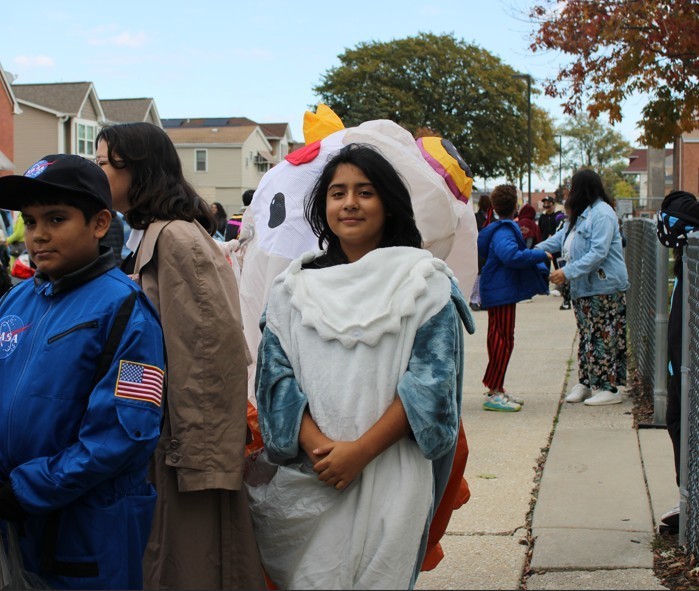 girl dressed in shark onsie