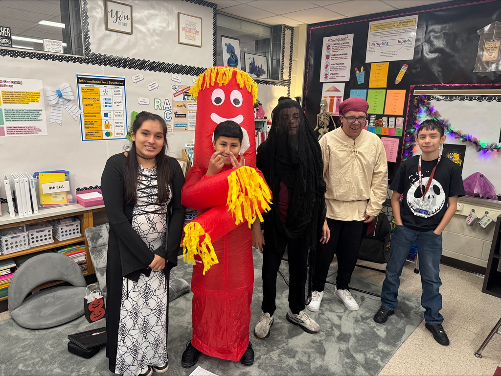 kids in Halloween costumes in class room