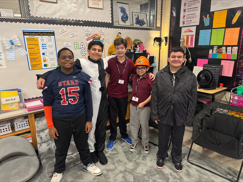 kids in Halloween costumes in class room