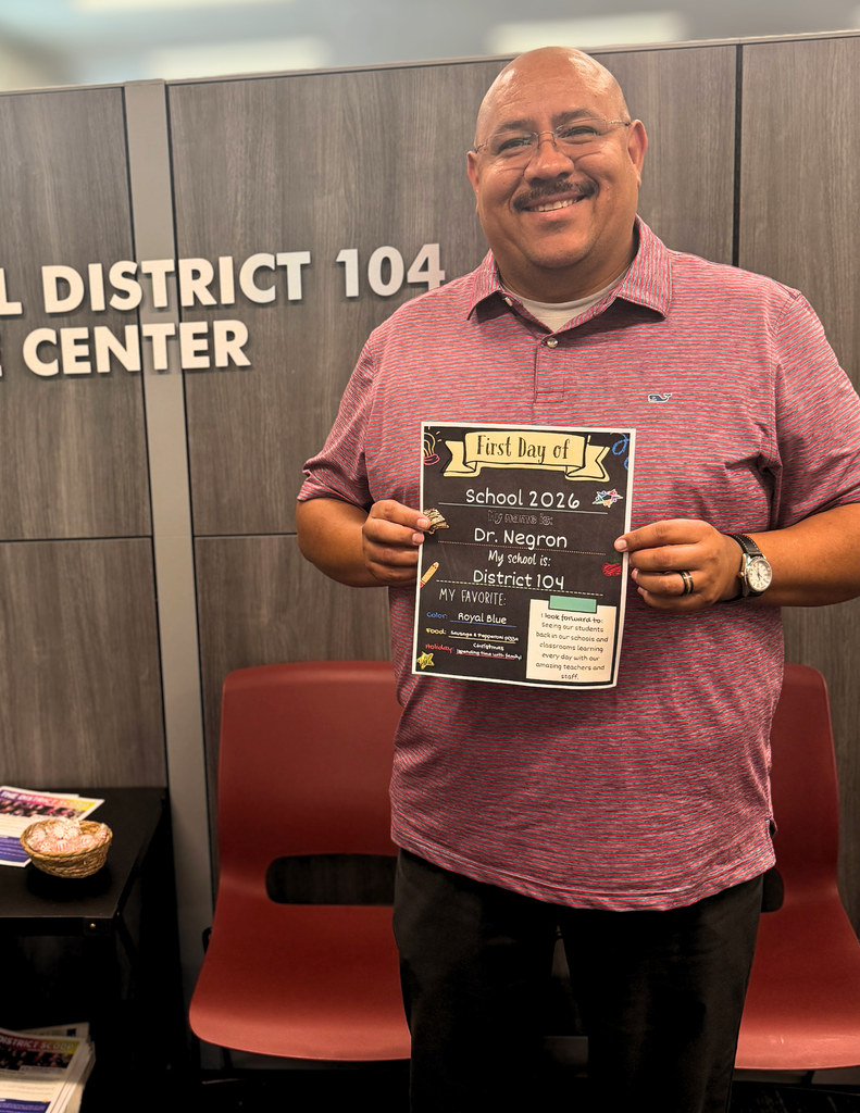 A man is seen holding a sign that states "District 104," signifying a particular district or area of interest.