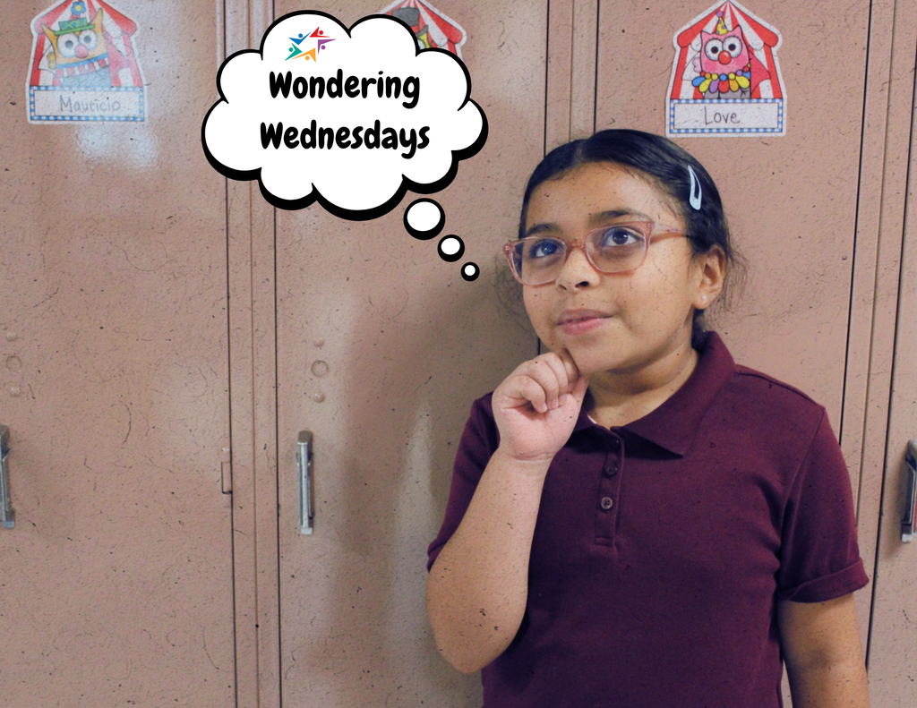 Young girl in glasses poses thoughtfully with a finger on her chin beneath a “Wondering Wednesdays” thought bubble, smiling at the camera.