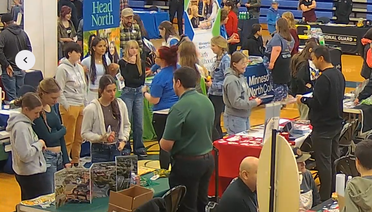 Cook County College Fair people walking around the tables talking to all vendors