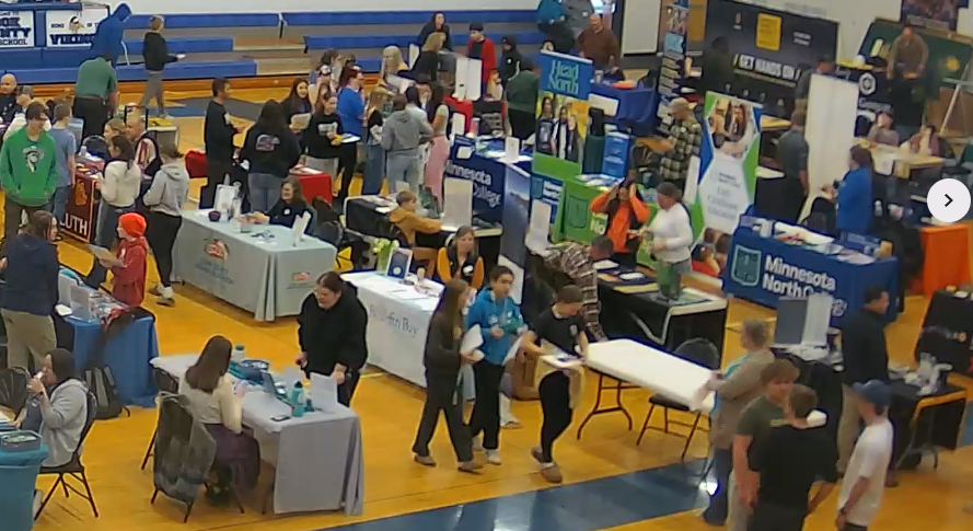 Cook County College Fair people walking around the tables talking to all vendors
