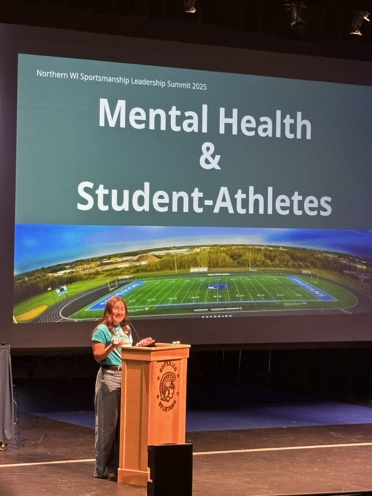 Keynote speaker, Ivie Brooks, with the introduction slide on the screen that reads: Mental Health & Student Athletes