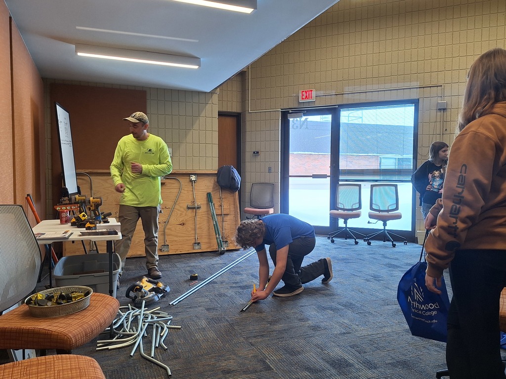 Presenter and student at event