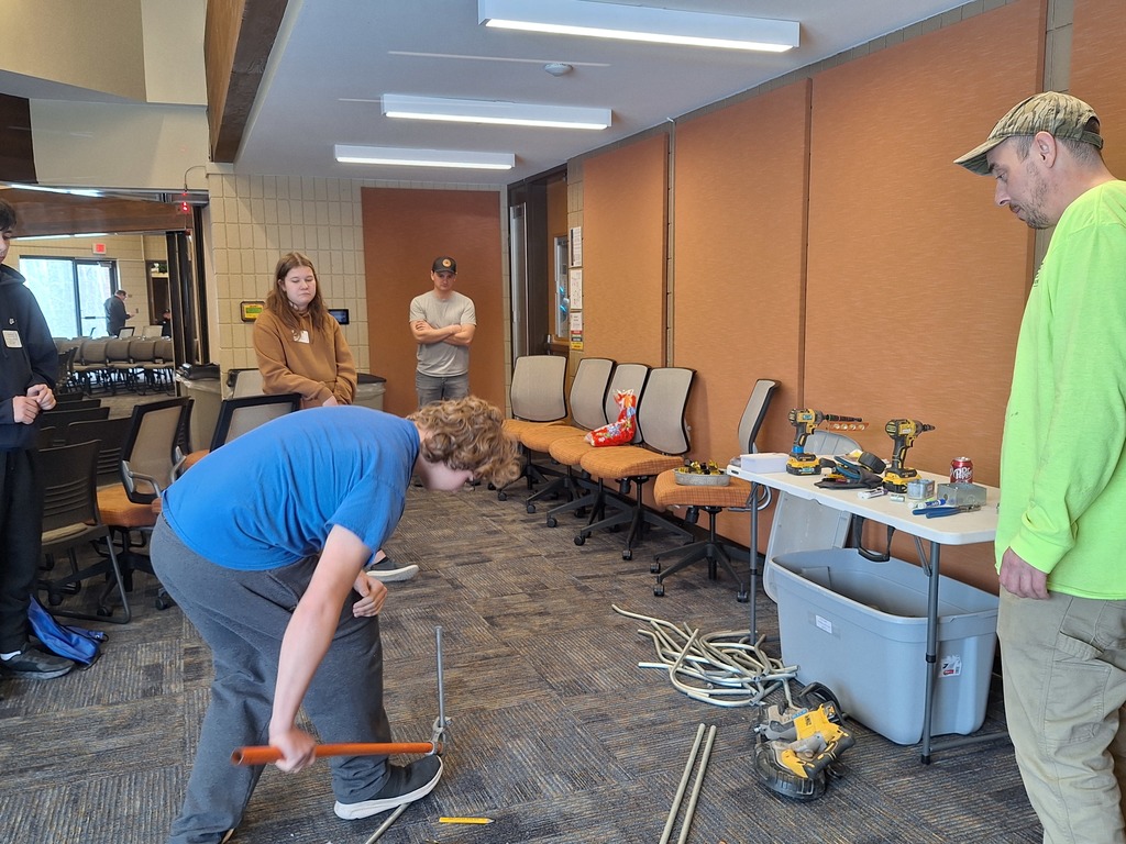 presenter and student at event