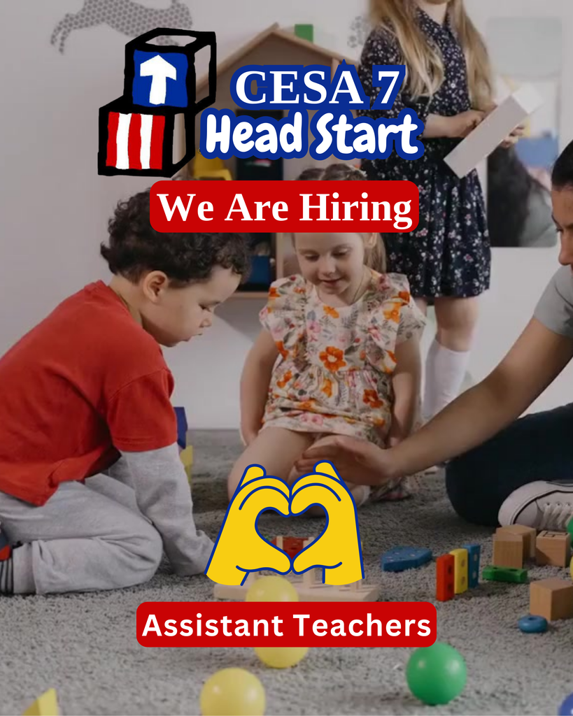 Teacher sitting on ground playing with two children who are also sitting