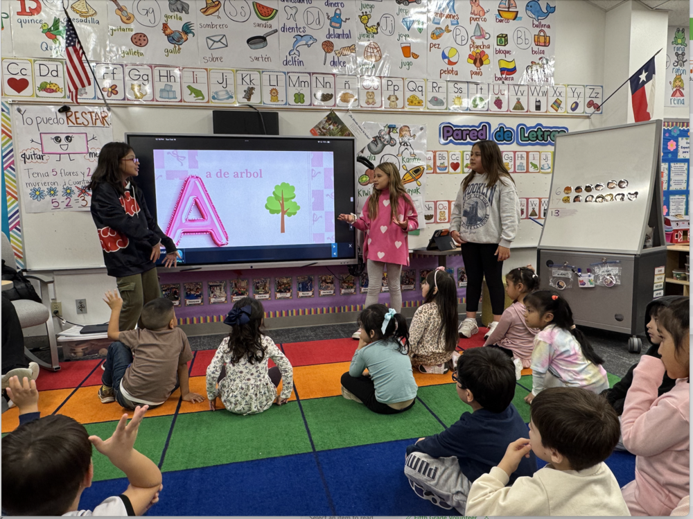 A photo of Wilson Elementary 5th graders mentor Pre-K students