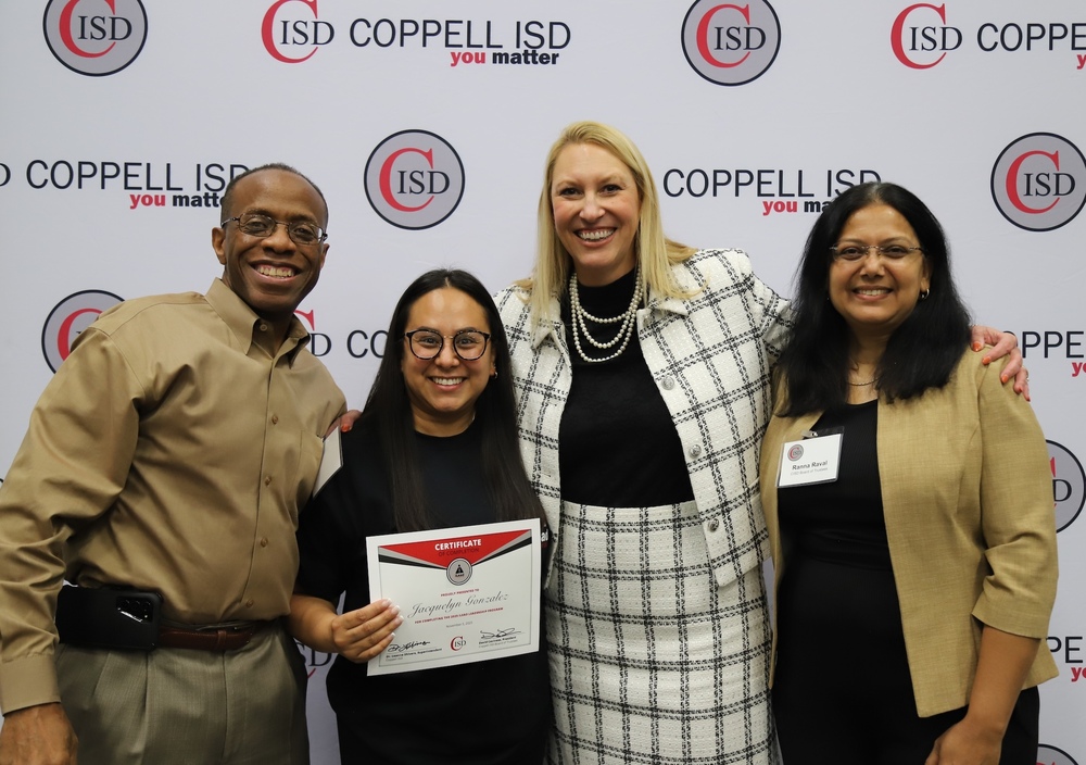 Four people pose together in front of a Coppell ISD “you matter” backdrop. One person holds a certificate recognizing Jacquelyn Gonzalez for completing the iLead Leadership Program.