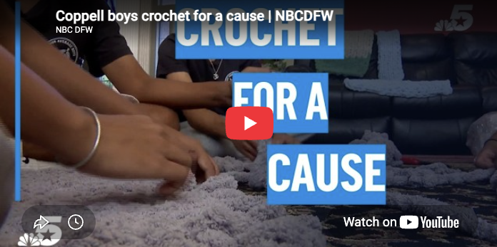 creenshot of a YouTube video preview from NBC DFW titled “Coppell boys crochet for a cause.” The image shows students’ hands crocheting on a rug with large text that reads “Crochet for a Cause,” a play button in the center and a “Watch on YouTube” label.